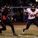 Tecumseh senior Spencer Hite ready to stiff arm a Milan defender on Friday. Tecumseh won 26-6. Daniel Brenner I AnnArbor.com